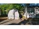 Exterior view of property showing additional storage structure with lake access at 1605 Sagamore Dr, Louisburg, NC 27549