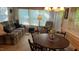 Inviting living area with a plush plaid sofa and abundant natural light at 1605 Sagamore Dr, Louisburg, NC 27549