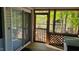 This screened porch has a sliding door, lattice, and wooden floor at 1605 Sagamore Dr, Louisburg, NC 27549