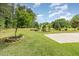 Expansive backyard with manicured lawn and decorative features; great for outdoor activities at 1619 Carriage Dr, Franklinton, NC 27525
