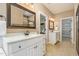 Bathroom featuring dual vanities, tile floors, and a glass enclosed shower at 1619 Carriage Dr, Franklinton, NC 27525