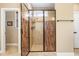 Well-lit bathroom featuring a glass-enclosed shower and neutral finishes at 1619 Carriage Dr, Franklinton, NC 27525