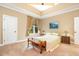 Cozy bedroom featuring a window with great natural light, carpeted floors, and tray ceilings at 1619 Carriage Dr, Franklinton, NC 27525