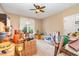 Bedroom with carpet, ceiling fan, and natural light is currently being used for storage at 1619 Carriage Dr, Franklinton, NC 27525