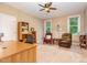 Cozy carpeted bedroom featuring natural light, a ceiling fan, and comfortable seating at 1619 Carriage Dr, Franklinton, NC 27525