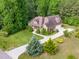 Aerial view of charming home with stone and siding and mature landscaping at 1619 Carriage Dr, Franklinton, NC 27525