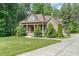 Inviting two-story home with stone and siding, with meticulously maintained landscaping at 1619 Carriage Dr, Franklinton, NC 27525