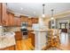 A functional kitchen with stainless appliances, granite counters, breakfast bar and hardwood floors at 1619 Carriage Dr, Franklinton, NC 27525