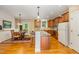 Bright kitchen featuring stainless appliances, hardwood floors, breakfast bar and an adjacent dining area at 1619 Carriage Dr, Franklinton, NC 27525