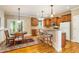 Lovely kitchen with hardwood floors, stainless appliances and a breakfast bar with seating for casual dining at 1619 Carriage Dr, Franklinton, NC 27525