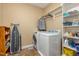 Functional laundry room equipped with a washer, dryer, and ample storage space at 1619 Carriage Dr, Franklinton, NC 27525