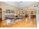 Open floor plan living room with hardwood floors and views of the kitchen and dining area at 1619 Carriage Dr, Franklinton, NC 27525