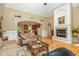 Spacious living room with fireplace, hardwood floors, and open access to the kitchen at 1619 Carriage Dr, Franklinton, NC 27525