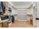 Spacious walk-in closet with plenty of shelving and hanging space at 1619 Carriage Dr, Franklinton, NC 27525