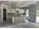 Unfinished kitchen featuring white cabinets, an island, and ample space for creating your dream culinary space at 169 Pecan Valley Way, Four Oaks, NC 27524