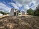 Spacious backyard featuring new home construction with covered patio at 183 Pecan Valley Way, Four Oaks, NC 27524