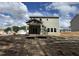 Home's backyard with a covered patio, new construction, ready for landscaping at 183 Pecan Valley Way, Four Oaks, NC 27524