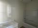 Bathroom featuring a vanity with a white countertop and a bathtub at 183 Pecan Valley Way, Four Oaks, NC 27524
