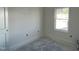 Bright, unfinished bedroom with a window providing natural light at 183 Pecan Valley Way, Four Oaks, NC 27524