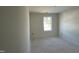 Unfinished bedroom with a window allowing natural light at 183 Pecan Valley Way, Four Oaks, NC 27524