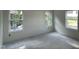 Bright and unfinished bedroom with three windows offering ample light at 183 Pecan Valley Way, Four Oaks, NC 27524