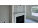 Close-up of a classic fireplace with a decorative white mantel at 183 Pecan Valley Way, Four Oaks, NC 27524