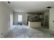Open concept kitchen featuring white cabinets and a large island at 183 Pecan Valley Way, Four Oaks, NC 27524