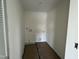 Bright laundry room featuring new flooring and fresh, white paint at 183 Pecan Valley Way, Four Oaks, NC 27524