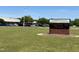 Four Oaks Middle School sign on a sunny day with cars parked nearby and an American flag in the background at 183 Pecan Valley Way, Four Oaks, NC 27524