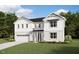 Charming two-story white home with a two car garage, landscaped lawn, and beautiful architectural details at 191 Yellow River Way, Garner, NC 27529