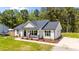 Well-maintained single-story home with manicured lawn, complementing its appealing facade at 1914 Jack Rd, Clayton, NC 27520