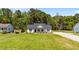 Inviting single-story home with a lush green lawn and picturesque landscaping at 1914 Jack Rd, Clayton, NC 27520