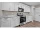 Modern kitchen featuring sleek stainless steel appliances, granite counters, and ample cabinet space at 1914 Jack Rd, Clayton, NC 27520
