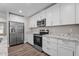 Well-equipped kitchen with stainless steel appliances, granite counters, and abundant storage space at 1914 Jack Rd, Clayton, NC 27520
