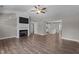 Cozy living room features a fireplace and flows seamlessly into the kitchen at 1914 Jack Rd, Clayton, NC 27520