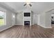 Spacious living room featuring a fireplace, modern fixtures, and stylish wood flooring throughout at 1914 Jack Rd, Clayton, NC 27520