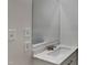 Bathroom vanity with marble countertop, brushed-metal faucet, and large mirror at 202 November St, Garner, NC 27529