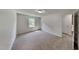 Bedroom with neutral carpet and walls, natural light from the window at 202 November St, Garner, NC 27529