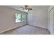 Bedroom featuring neutral paint, new carpet, closet, and natural light at 202 November St, Garner, NC 27529