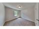 Bedroom with neutral carpet and walls, natural light from the window at 202 November St, Garner, NC 27529