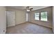 Bedroom featuring neutral paint, new carpet, closet, and natural light at 202 November St, Garner, NC 27529