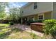 Well-maintained backyard featuring lush greenery, a patio, and a hot tub at 203 Downing Bluff Dr, Morrisville, NC 27560