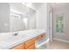 Bathroom featuring single sink vanity, a large mirror, a window, and a shower/tub combo at 203 Downing Bluff Dr, Morrisville, NC 27560
