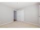 Bedroom featuring neutral carpet and paint with an open closet revealing a walk-in closet at 203 Downing Bluff Dr, Morrisville, NC 27560