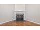 Close up of a stylish fireplace in living room with hardwood floors at 203 Downing Bluff Dr, Morrisville, NC 27560