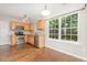 Eat-in kitchen features stainless steel appliances and a bright window at 203 Downing Bluff Dr, Morrisville, NC 27560