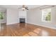 Spacious living room with hardwood floors and a cozy fireplace at 203 Downing Bluff Dr, Morrisville, NC 27560