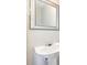 The powder room features a pedestal sink and modern fixtures at 203 Downing Bluff Dr, Morrisville, NC 27560