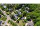Neighborhood aerial view featuring lush tree coverage and well-maintained homes in a suburban setting at 205 Buncombe St, Raleigh, NC 27609