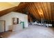 Unfinished attic with plywood flooring, exposed wood framing, and ductwork at 205 Buncombe St, Raleigh, NC 27609